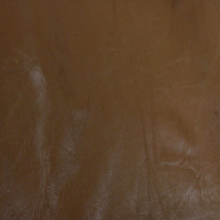 face of a chocolate colored lambskin hide with a subtle sheen to it