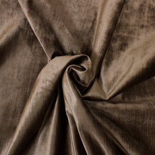 swirl of a dark brown velveteen upholstery fabric