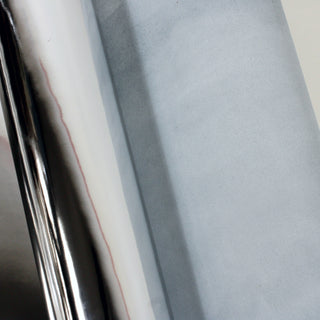 backside of chrome patent leather piece folded over