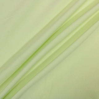 three diagonal lines of a bright citron colored interlock knit jersey fabric