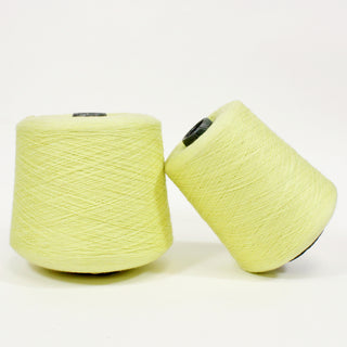 two cones of citron colored ultra-fine yarn