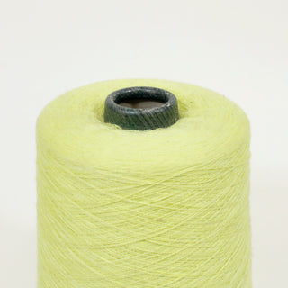 close-up of a cone of ultra-fine citron colored yarn