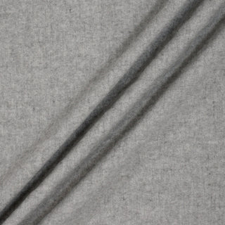 cloud grey wool-blend felt fabric arranged to show three draped lines on its surface to demonstrate the soft and structured drape