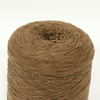 close-up of a cone of cocoa brown colored curly slub yarn