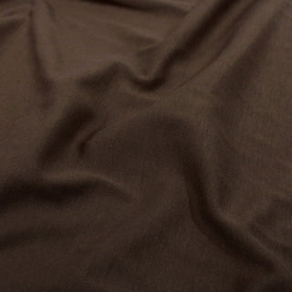 close-up of cocoa jersey fabric demonstrating the knit texture and hand of the fabric