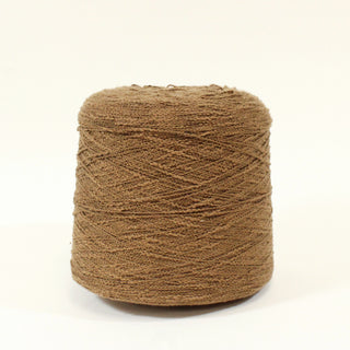cone of cocoa brown colored slub yarn with a curly texture