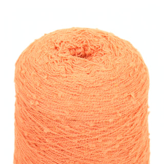Close-up of large coral fine-weight slub yarn cone on a white background.