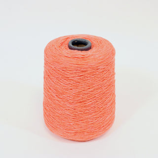 medium cone of yarn, lightweight worsted yarn in a bright coral color