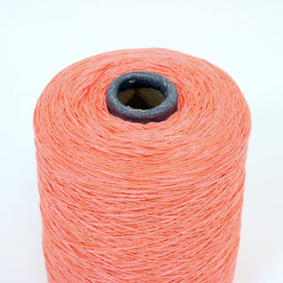 close-up of a medium cone of lightweight worsted coral color yarn