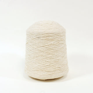 large cone of cream colored slub textured yarn