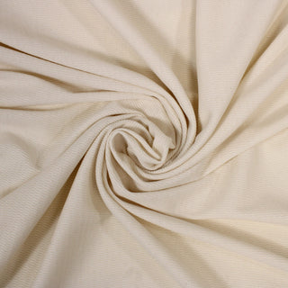 swirl of an off-white colored texture knit jersey fabric