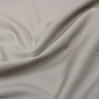 close-up of egret colored lightweight twill fabric, detailing the weave and matte face
