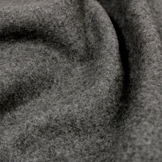 close-up of a mid-grey colored wool-blend felted fabric, detailing its fabric structure and soft felted hand