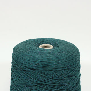 close-up of a large emerald green sparkley yarn cone, detailing the midweight gauge of the yarn