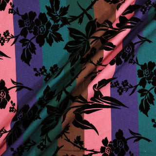 Three lines draped of a flocked multi stripe fabric.