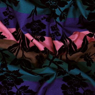 Close up of a flocked multi stripe fabric, detailing the surface shine.
