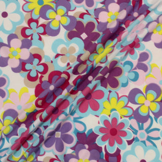 three diagonal lines draped of a multicolor graphic floral jersey fabric