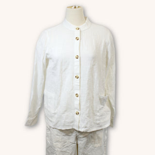 gauzy white button up shirt with faux horn buttons on a mannequin