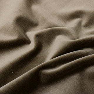 close-up of gingerbread brown colored velveteen fabric, detailing its soft hand and woven pile structure