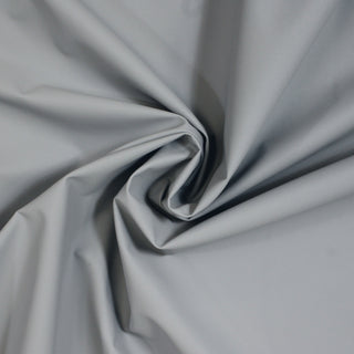 swirl of glacier colored textured vinyl fabric, demonstrating its stiff hand