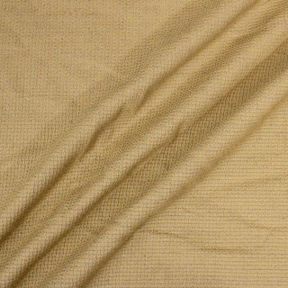 three diagonal lines arranged using goldenrod colored woven/textured upholstery fabric, demonstrating its structured hand and rough surface