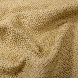 close-up of goldenrod colored textured upholstery fabric, detailing its grid-woven structure