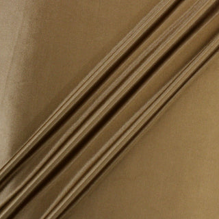 gold interlock viscose jersey fabric manipulated into three diagonal peaks to show the subtle shine and soft draping quality