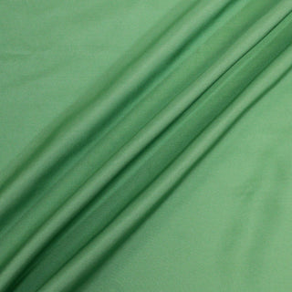 three diagonal lines arranged of a grasshopper green colored silk mikado fabric, demonstrating its subtle sheen and drape