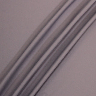 rumple of grey-lavender tricot fabric, demonstrating its hand and face