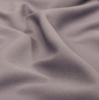 close-up of grey-lavender fabric showing the detail of the knit structure