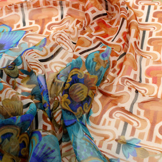 close-up of a groovy-printed multicolor silk chiffon fabric, detailing the level of sheerness and some of the motifs