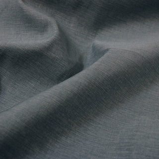 close-up of heathered glacier blue-grey broadcloth fabric, detailing the weave and crisp hand