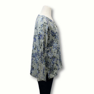 side view of a floral henley sweatshirt