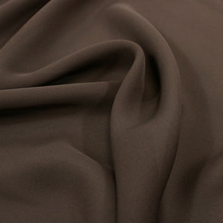 close-up of hickory brown colored silk chiffon fabric, detailing its soft hand and drapey quality