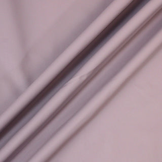 three lines arranged diagonally of hyacinth colored textured vinyl fabric, demonstrating its structured drape