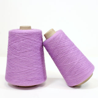 two yarn cones in a pale purple color, ultra-fine gauge