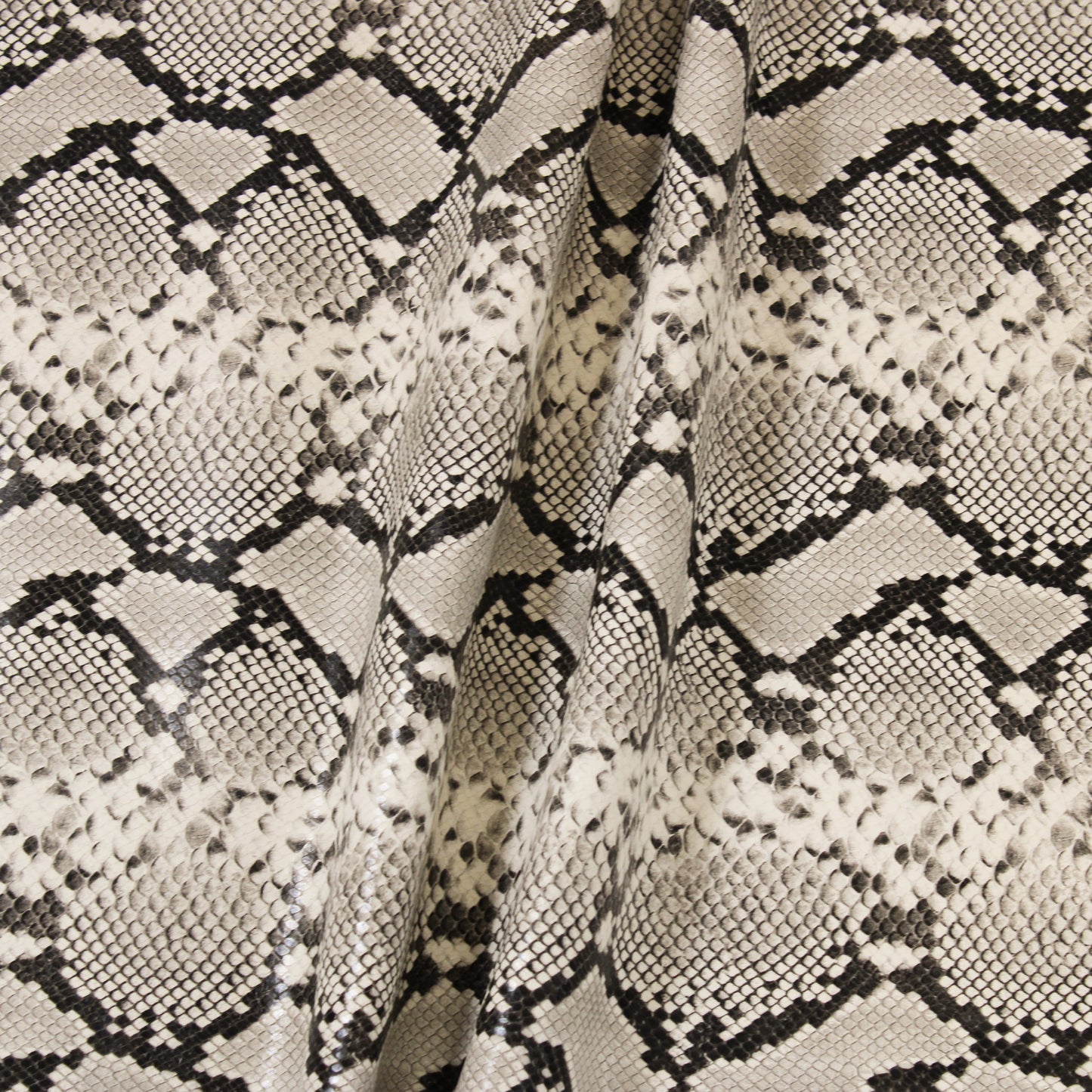 CREAM EMBOSSED SNAKE PRINT COW HIDE