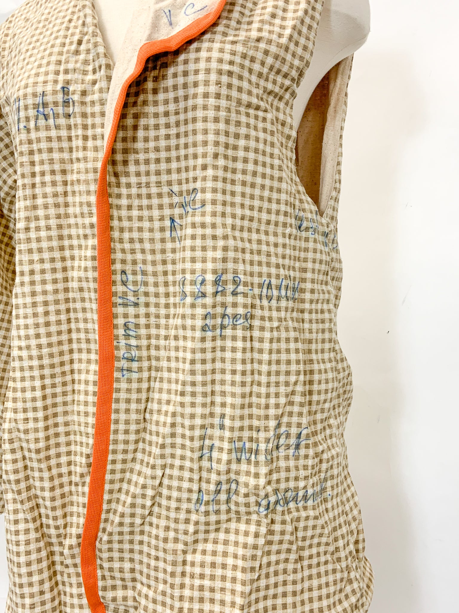 close up of front showing writing on the fabric in blue