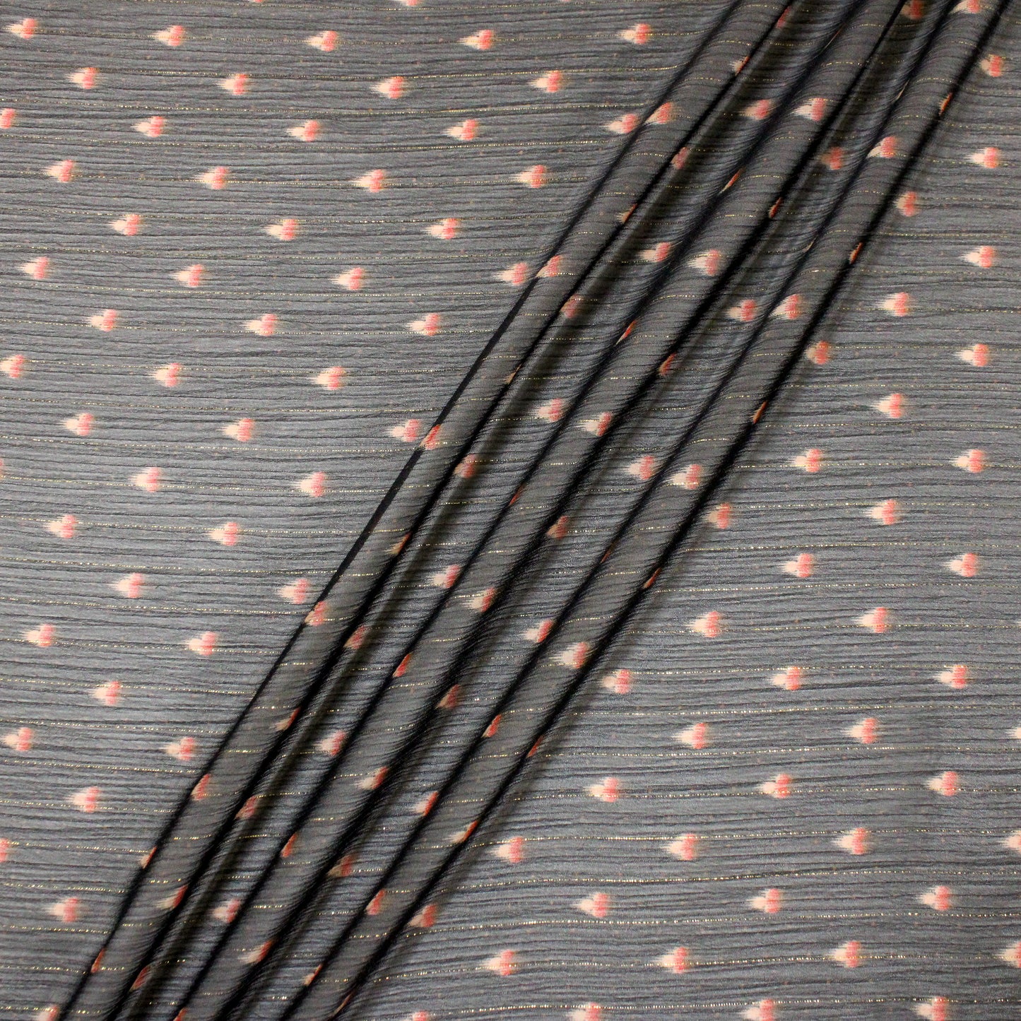 birds eye view of fabric with three ripples running diagonally