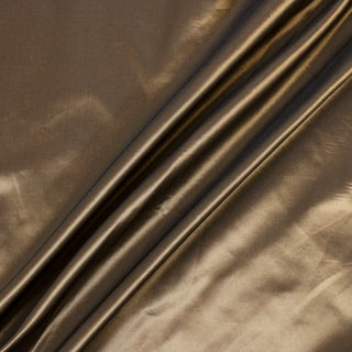 three diagonal lines arranged across taffeta fabric to show its iridescence and crisp drape