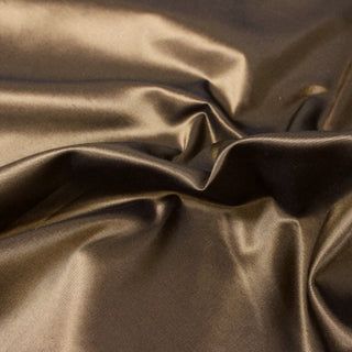 close-up of iridescent bronze colored silk taffeta fabric, detailing its weave structure and subtle sheen
