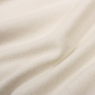 close-up of felted ivory wool fabric, detailing soft face with slight texture