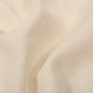 close-up of ivory colored linen fabric, detailing its plainweave and slub variation