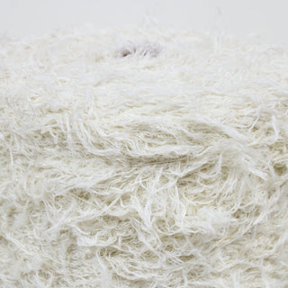 close-up of a large cone of ivory shaggy yarn
