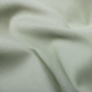 close-up of jade green twill fabric, detailing the weave