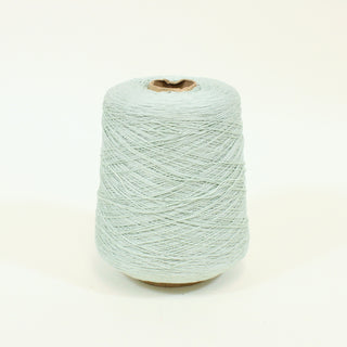 cone of pale jade colored ultra-fine-gauge worsted yarn