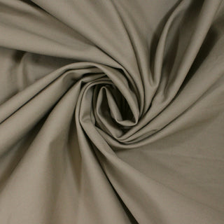 swirl of khaki chino fabric, demonstrating the structured drape and stiffer hand