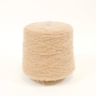 large yarn cone of fine-gauge, fuzzy yarn in a latte beige color