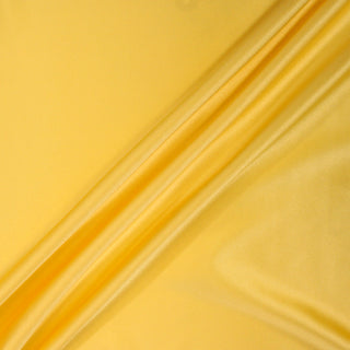 three diagonal lines draped of a yellow stretch-silk charmeuse fabric