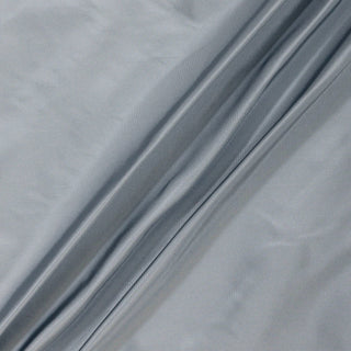 light blue colored silk taffeta fabric draped in three lines to show its structured and lightweight hand